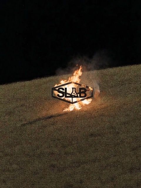 SLAB logo over burning field